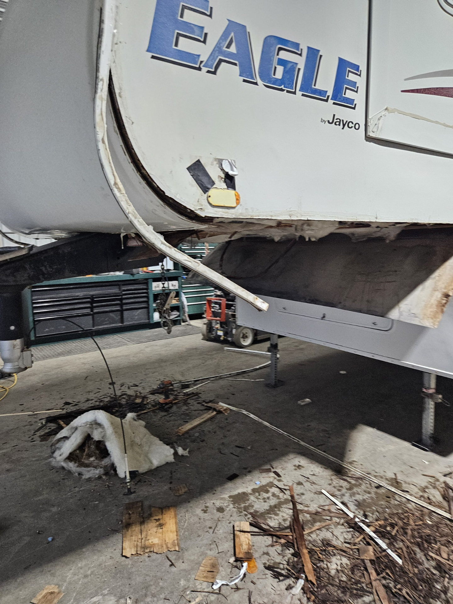 Fifth wheel jacked up in the shop for structural repair