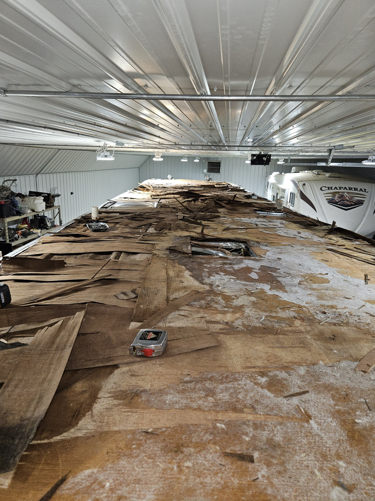 Rotted RV roof decking exposed during a tear-off