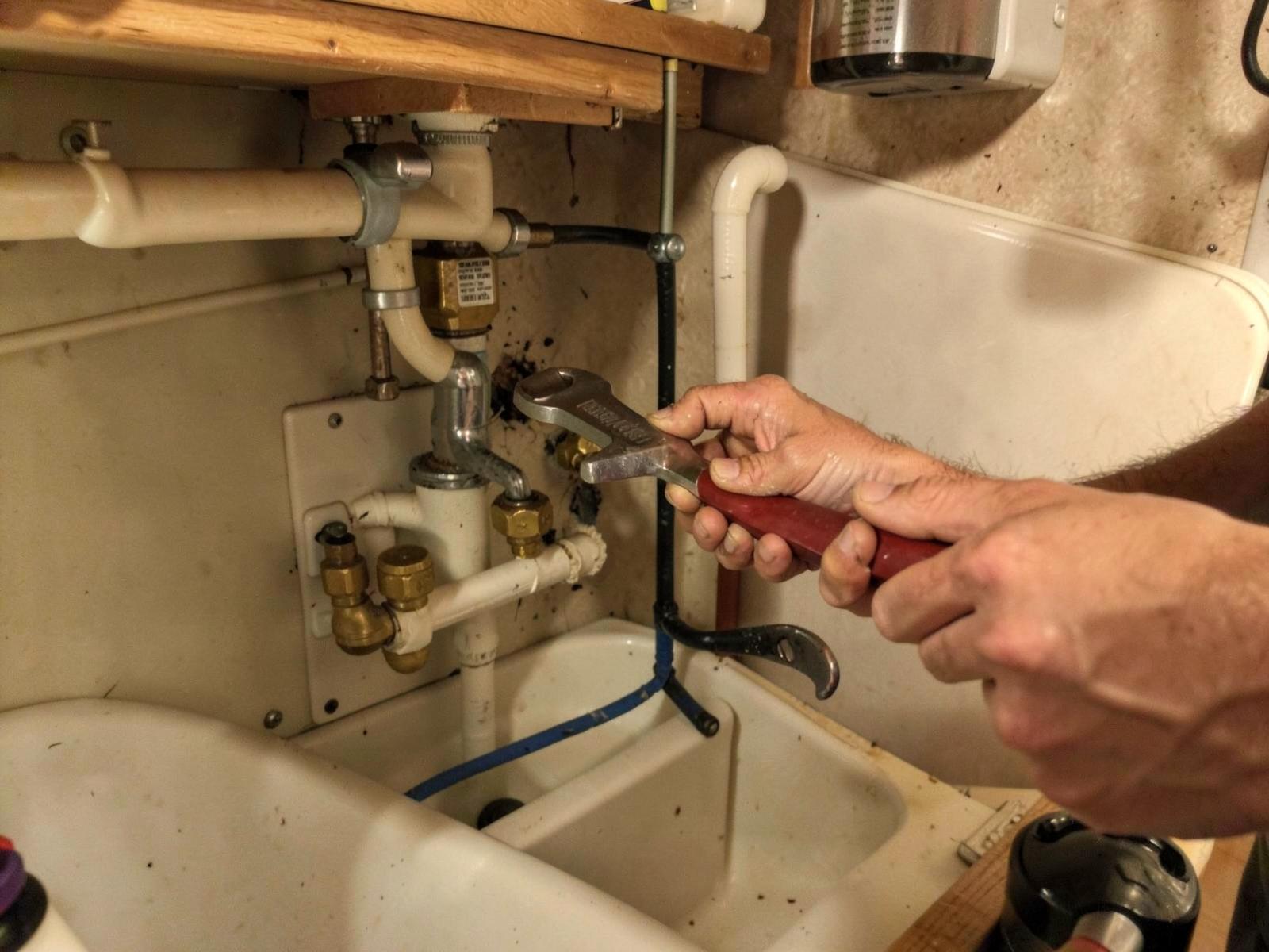 PEX water line and fitting repair inside an RV cabinet